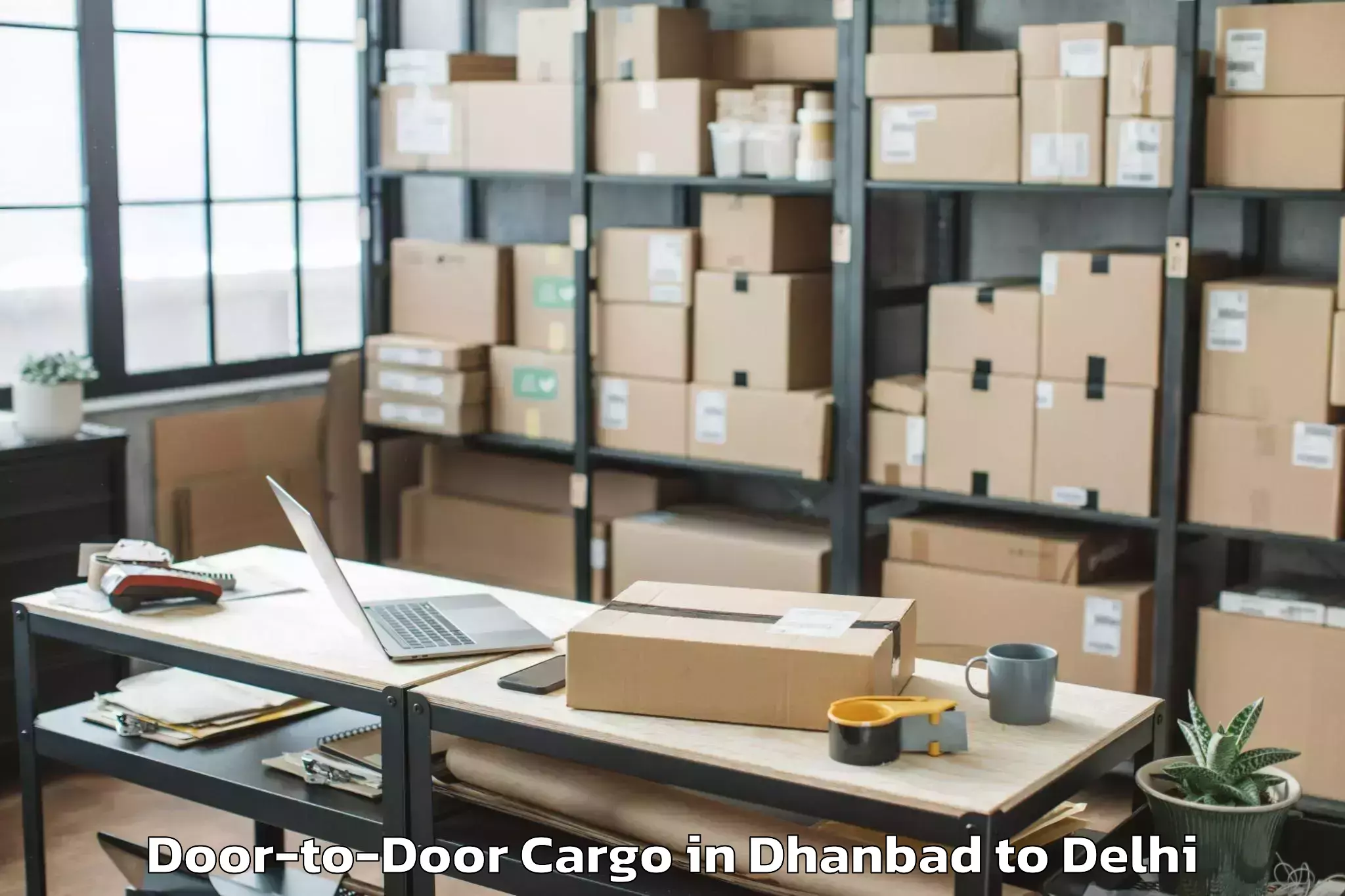 Leading Dhanbad to Jmd Kohinoor Mall Door To Door Cargo Provider